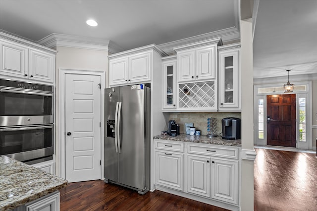 1206 Arcilla Pt, Martinez, GA 30907 - kitchen with appliances with stainless steel finishes, ornamental molding, dark wood finished floors, glass insert cabinets, and white cabinets