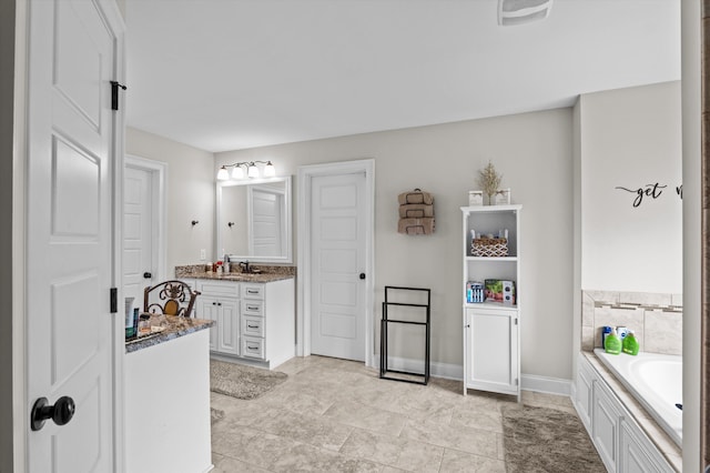 1206 Arcilla Pt, Martinez, GA 30907 - bathroom with vanity, a garden tub, and baseboards