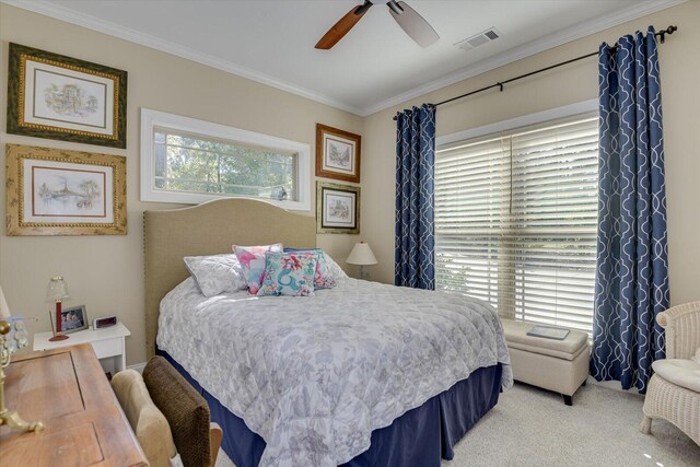 carpeted bedroom featuring multiple windows, ceiling fan, and crown molding