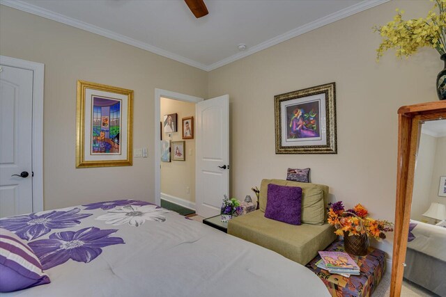 bedroom with ceiling fan and crown molding