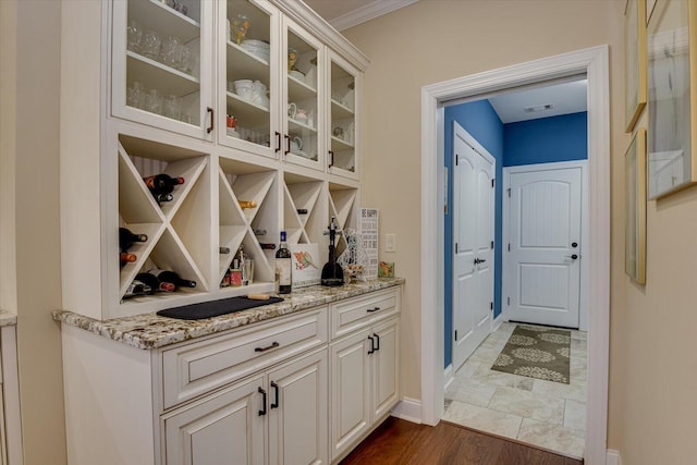 106 Bereau Dr, Mccormick, SC 29835 - wine room featuring baseboards, crown molding, and dark wood finished floors