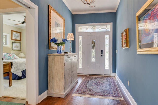 106 Bereau Dr, Mccormick, SC 29835 - entryway featuring wood finished floors, ceiling fan, baseboards, and crown molding