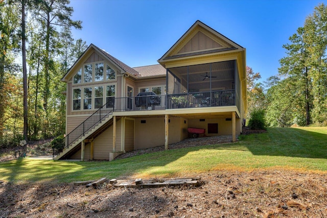 106 Bereau Dr, Mccormick, SC 29835 - rear view of house with stairway, a sunroom, a lawn, and a deck