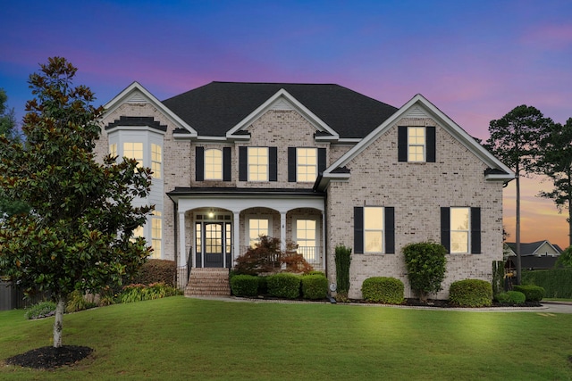 2224 Fothergill Dr, Evans, GA 30809 - traditional-style house with brick siding, a front lawn, and covered porch