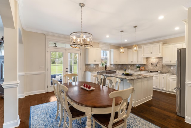 2224 Fothergill Dr, Evans, GA 30809 - dining room featuring dark wood finished floors, a chandelier, crown molding, recessed lighting, and baseboards
