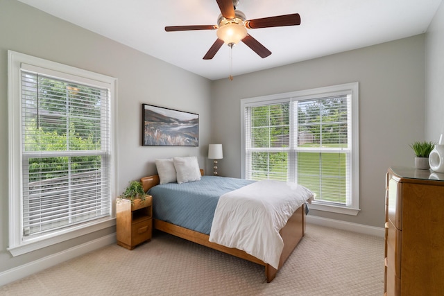 2224 Fothergill Dr, Evans, GA 30809 - bedroom with baseboards, light colored carpet, and a ceiling fan