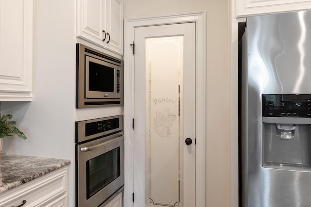 2224 Fothergill Dr, Evans, GA 30809 - kitchen with appliances with stainless steel finishes and white cabinets