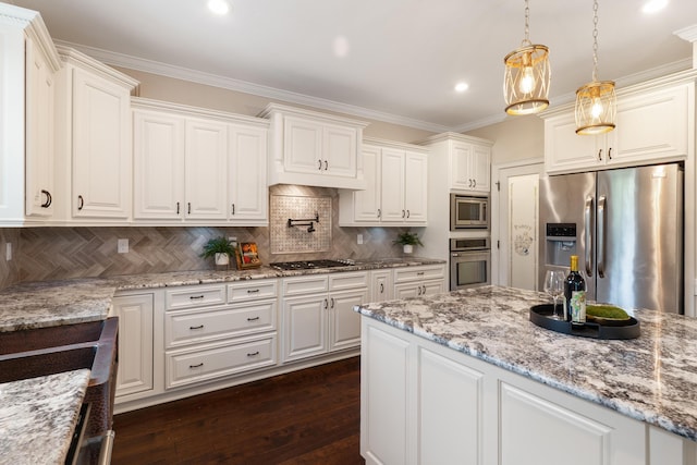 2224 Fothergill Dr, Evans, GA 30809 - kitchen featuring appliances with stainless steel finishes, dark wood finished floors, crown molding, hanging light fixtures, and white cabinetry