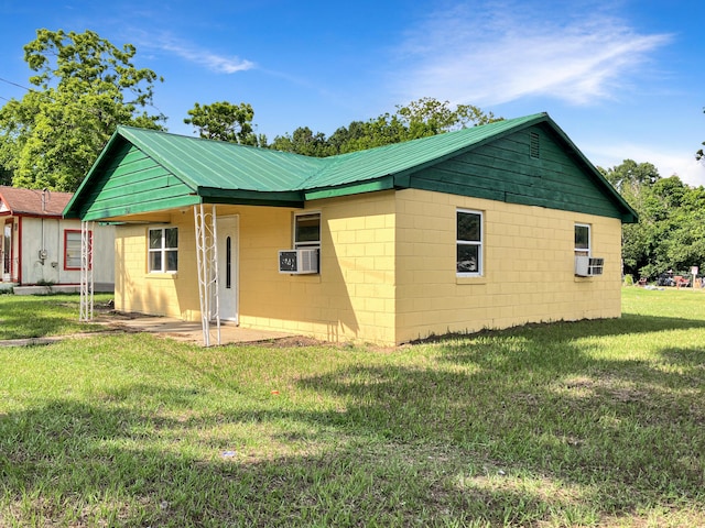 802 Yellow Town Rd, Waynesboro, GA 30830 - back of house with a yard, metal roof, cooling unit, and concrete block siding