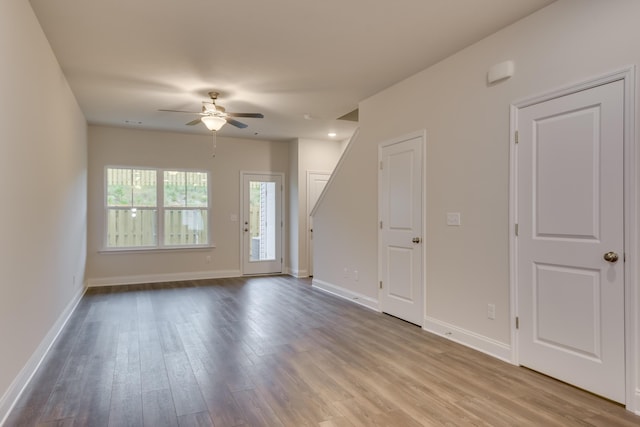 unfurnished room featuring ceiling fan and light wood-type flooring