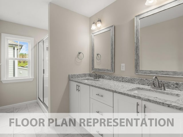 full bath with double vanity, a stall shower, marble finish floor, and a sink