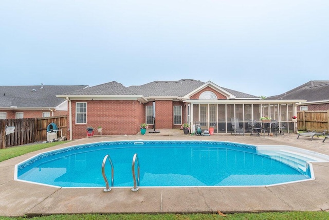 2108 Glenn Fls, Grovetown, GA 30813 - view of swimming pool featuring a sunroom, a fenced backyard, and a patio area
