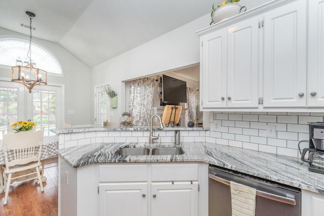 2108 Glenn Fls, Grovetown, GA 30813 - kitchen with stainless steel dishwasher, a sink, a chandelier, vaulted ceiling, and white cabinetry