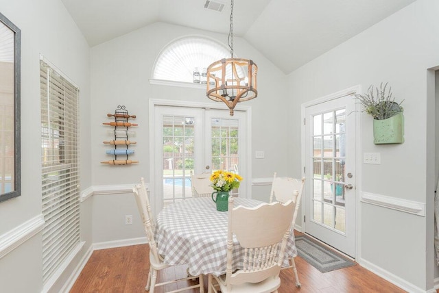 2108 Glenn Fls, Grovetown, GA 30813 - dining room with a chandelier, wood finished floors, lofted ceiling, and healthy amount of natural light