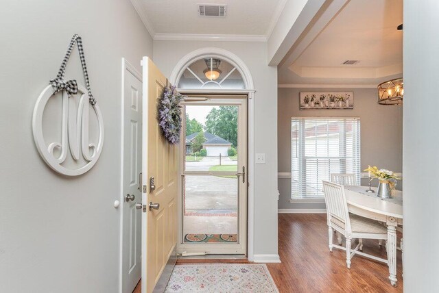 2108 Glenn Fls, Grovetown, GA 30813 - foyer featuring wood finished floors, ornamental molding, a chandelier, and baseboards