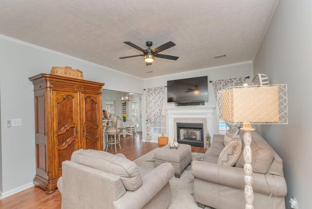 2108 Glenn Fls, Grovetown, GA 30813 - living area with wood finished floors, ceiling fan, a textured ceiling, baseboards, and a fireplace