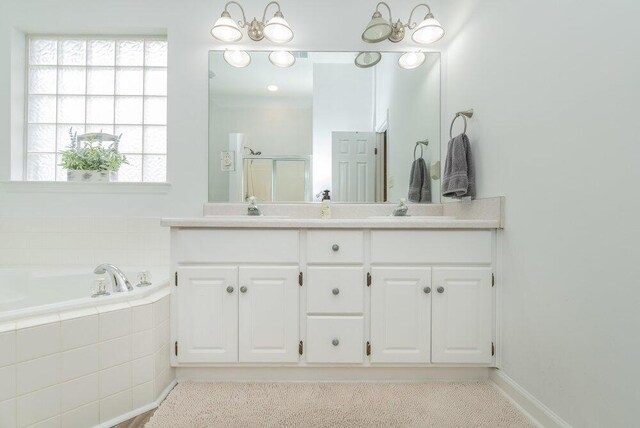 2108 Glenn Fls, Grovetown, GA 30813 - full bath with double vanity, a shower stall, a bath, and baseboards