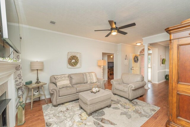 2108 Glenn Fls, Grovetown, GA 30813 - living room with a ceiling fan, a fireplace, wood finished floors, decorative columns, and baseboards