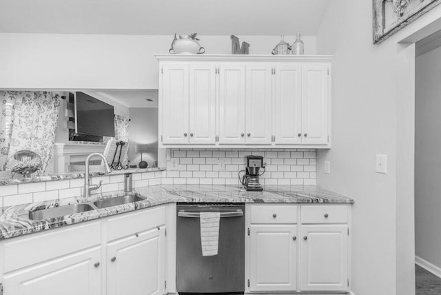 2108 Glenn Fls, Grovetown, GA 30813 - kitchen with stainless steel dishwasher, a sink, backsplash, and white cabinetry