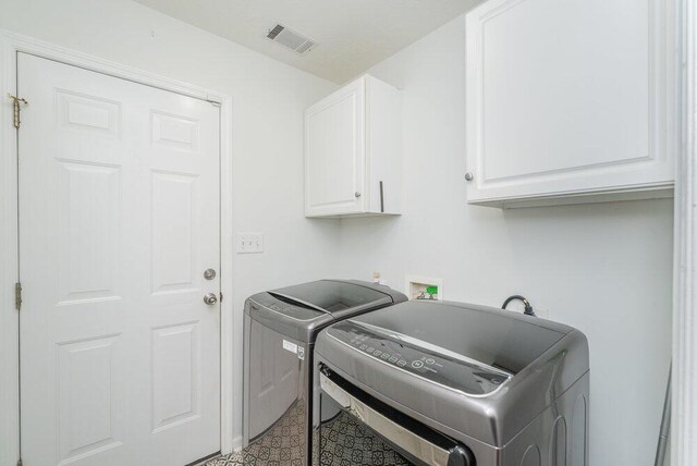 2108 Glenn Fls, Grovetown, GA 30813 - laundry area with cabinet space and washing machine and clothes dryer