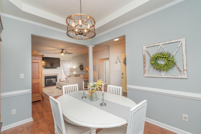 2108 Glenn Fls, Grovetown, GA 30813 - dining area with ceiling fan, a fireplace, wood finished floors, and ornate columns