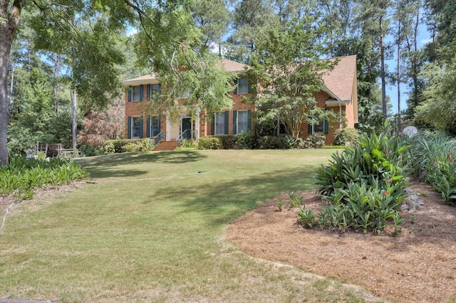 view of front of home with a front lawn