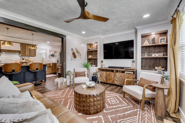 2206 Sandra Ct, Augusta, GA 30906 - living area with dark wood-style floors, ceiling fan, a textured ceiling, ornamental molding, and recessed lighting