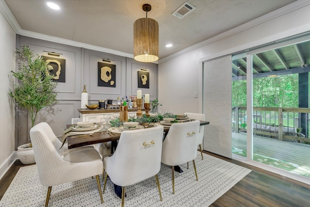 2206 Sandra Ct, Augusta, GA 30906 - dining space with crown molding, dark wood-style floors, healthy amount of natural light, recessed lighting, and a decorative wall
