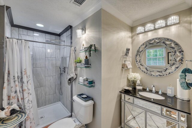 2206 Sandra Ct, Augusta, GA 30906 - bathroom featuring a textured ceiling, a shower stall, vanity, crown molding, and toilet