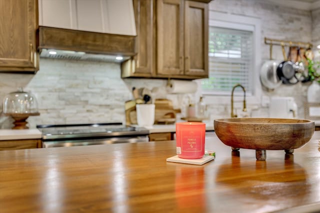 2206 Sandra Ct, Augusta, GA 30906 - kitchen featuring wooden counters, electric stove, backsplash, and a sink