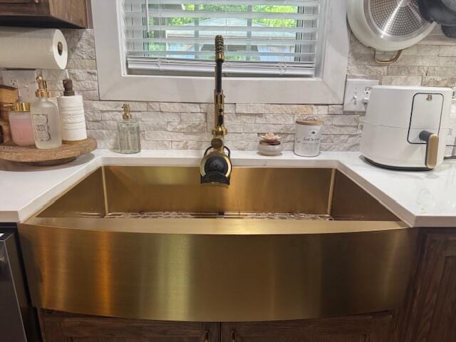2206 Sandra Ct, Augusta, GA 30906 - kitchen view of light countertops, backsplash, and a sink
