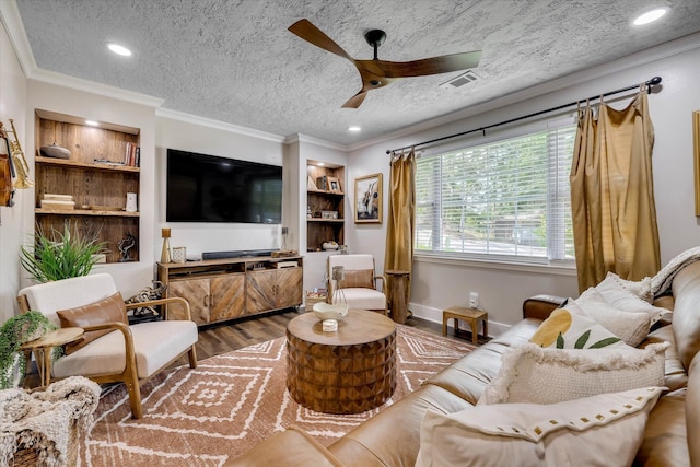 2206 Sandra Ct, Augusta, GA 30906 - living area featuring wood finished floors, a ceiling fan, recessed lighting, crown molding, and built in features