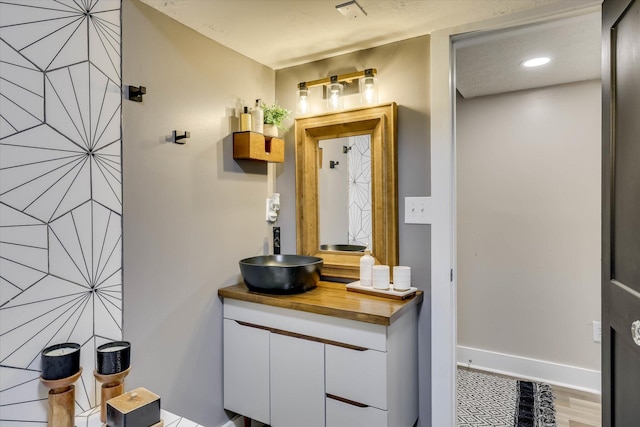 2206 Sandra Ct, Augusta, GA 30906 - bathroom featuring vanity, wood finished floors, and baseboards