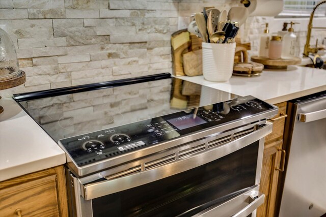 2206 Sandra Ct, Augusta, GA 30906 - kitchen featuring appliances with stainless steel finishes, decorative backsplash, and light countertops