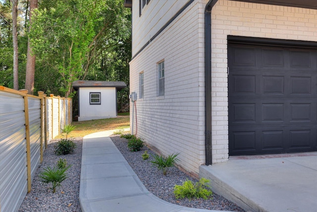 2206 Sandra Ct, Augusta, GA 30906 - view of property exterior with brick siding, an outbuilding, and an attached garage
