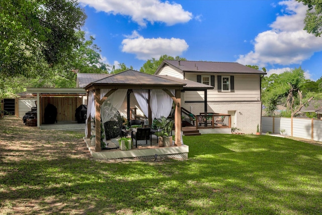 2206 Sandra Ct, Augusta, GA 30906 - rear view of house with a gazebo, a wooden deck, and brick siding
