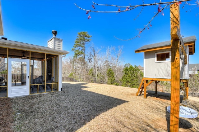 view of yard with a sunroom