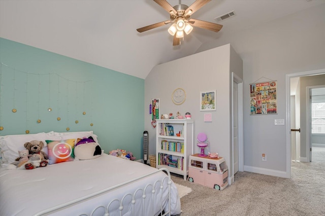 bedroom with visible vents, light carpet, lofted ceiling, baseboards, and ceiling fan