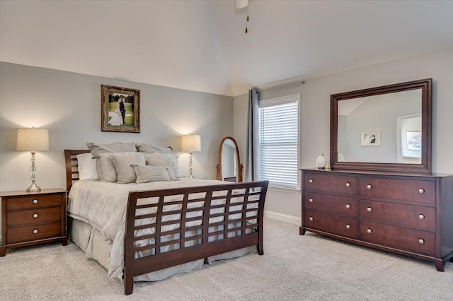 bedroom with baseboards, lofted ceiling, light colored carpet, and a ceiling fan