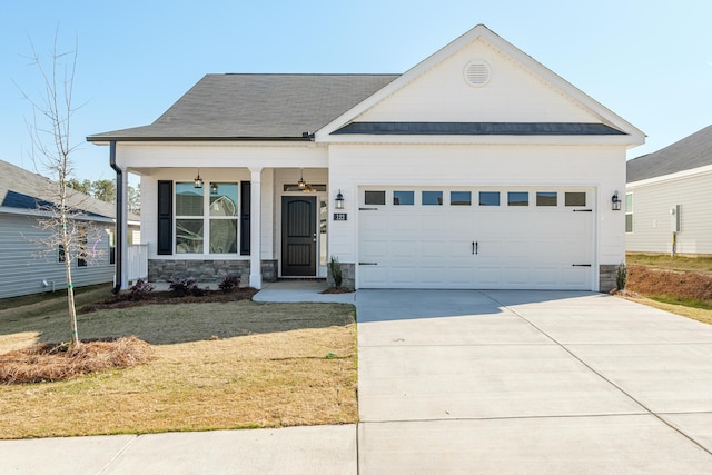 view of front of home featuring a garage and a front lawn