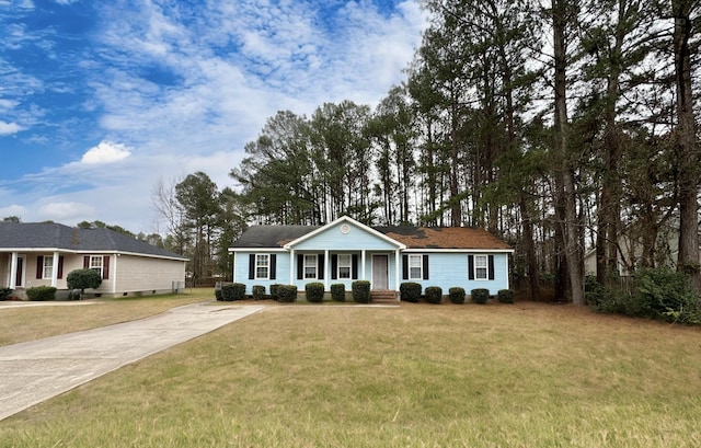 ranch-style house with a front lawn