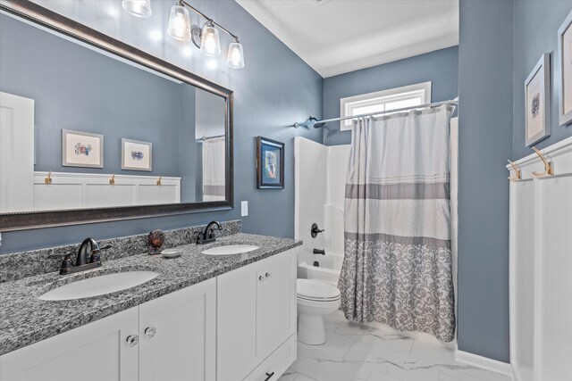 1037 Bartram Rdg, Evans, GA 30809 - bathroom featuring double vanity, marble finish floors, and shower / bath combo with shower curtain