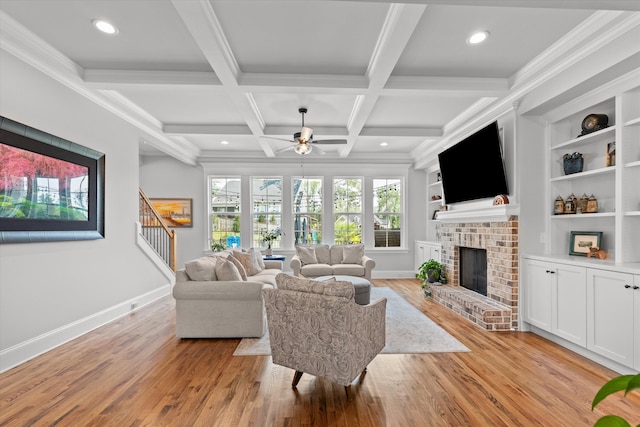 1037 Bartram Rdg, Evans, GA 30809 - living area featuring a ceiling fan, a brick fireplace, stairs, light wood-type flooring, and beamed ceiling