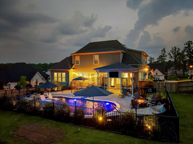 1037 Bartram Rdg, Evans, GA 30809 - back of house featuring a fire pit, a fenced backyard, and a patio area