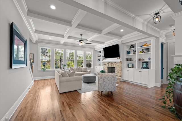 1037 Bartram Rdg, Evans, GA 30809 - living room featuring a ceiling fan, a brick fireplace, light wood-style floors, beam ceiling, and ornamental molding