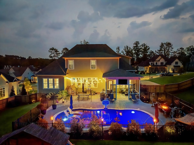 1037 Bartram Rdg, Evans, GA 30809 - back of property featuring a fire pit, a fenced backyard, and a patio area
