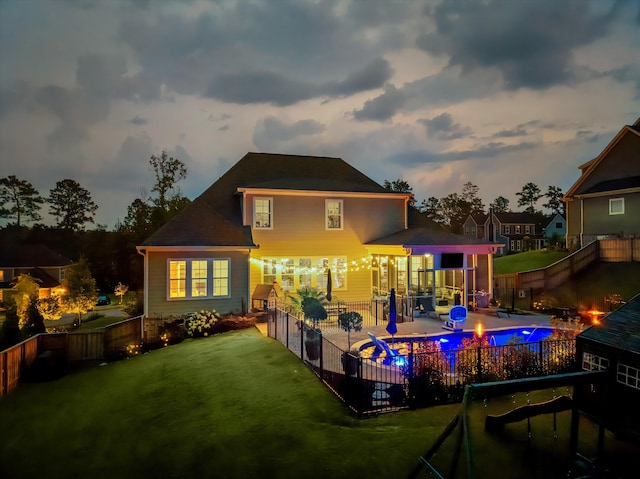 1037 Bartram Rdg, Evans, GA 30809 - back of property at dusk featuring a fenced backyard and a patio area