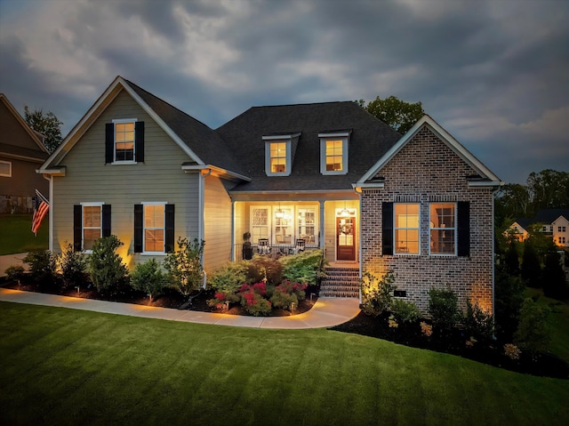 1037 Bartram Rdg, Evans, GA 30809 - view of front of house featuring a porch, a front lawn, and brick siding