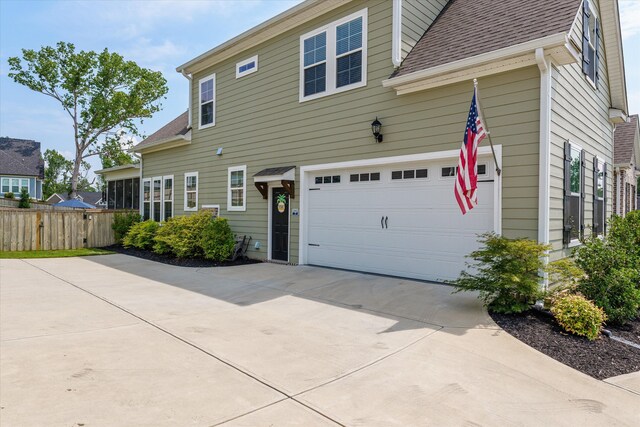 1037 Bartram Rdg, Evans, GA 30809 - view of home's exterior featuring driveway, a shingled roof, and an attached garage