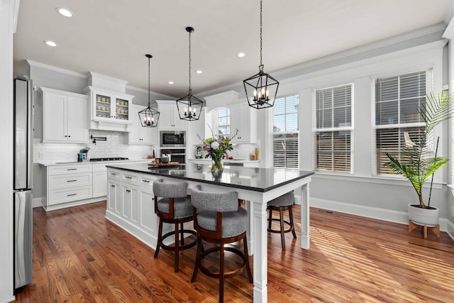 1037 Bartram Rdg, Evans, GA 30809 - kitchen featuring appliances with stainless steel finishes, recessed lighting, decorative backsplash, a chandelier, and crown molding